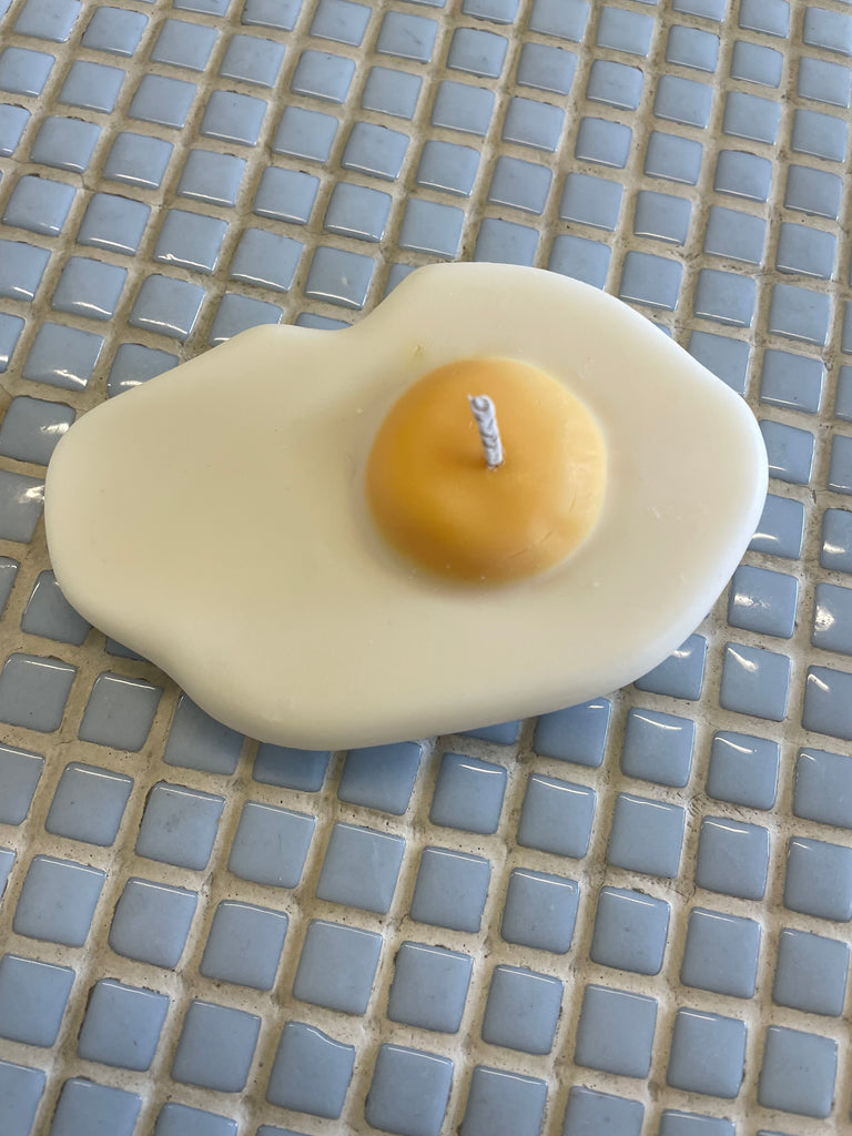 nata concepts fried egg candle